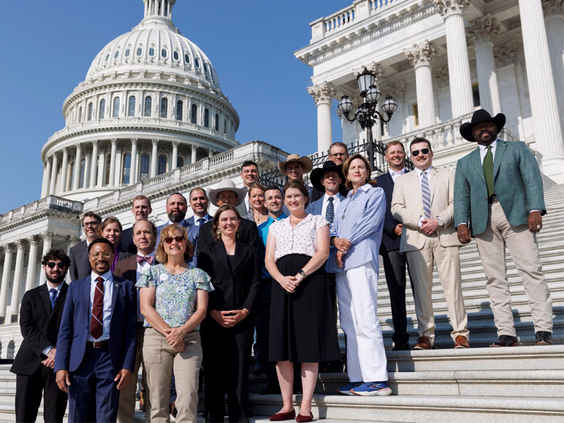 Photo of farmers, ranchers, and Audubon staff gathered on the steps of Capitol Hill.