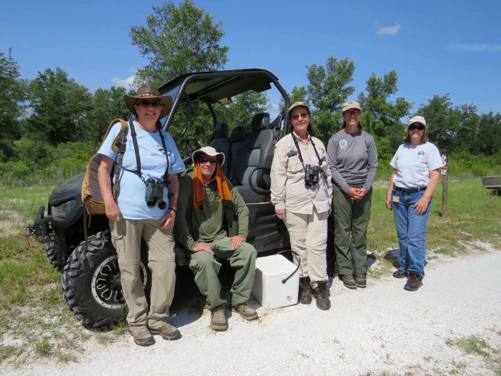 people standing in front of a truck