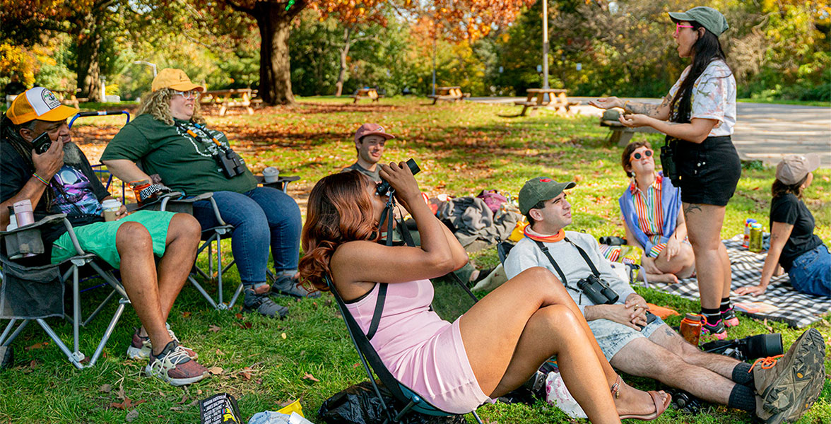 Participants at a bird sit organized by the Feminist Bird Club in Prospect Park, Brooklyn, NY.