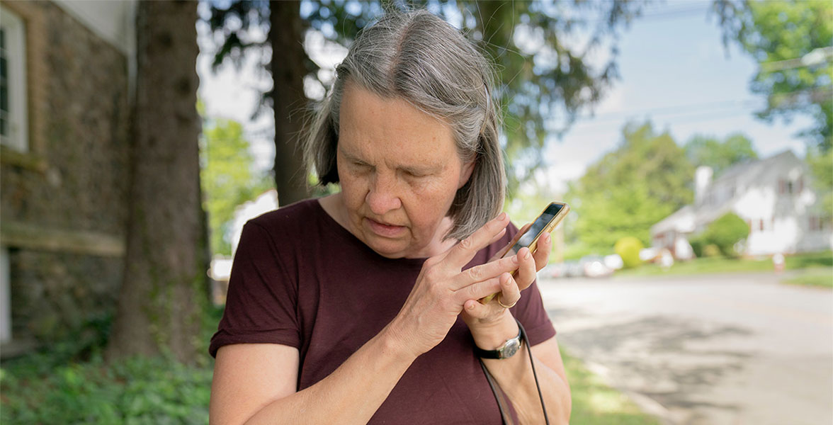 Tracy Carcione, a blind birder who participated in the Bird-a-Thon near her home in Teaneck, New Jersey, listens as Merlin identifies birdsong using the app’s text-to-speech function.