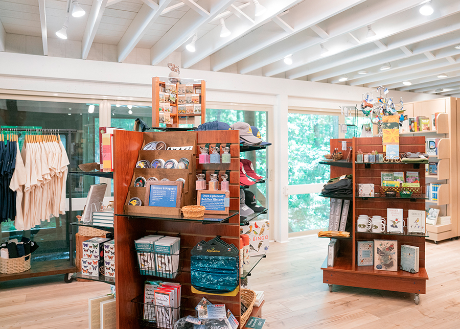 New merchandise (like hats, keychains, stickers) set out on large displays in Beidler's gift shop. 