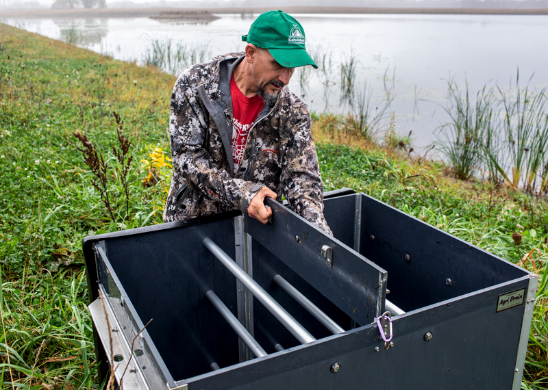 Tony Kuchma, Oneida Nation wetlands project manager, checks on a restored wetland.