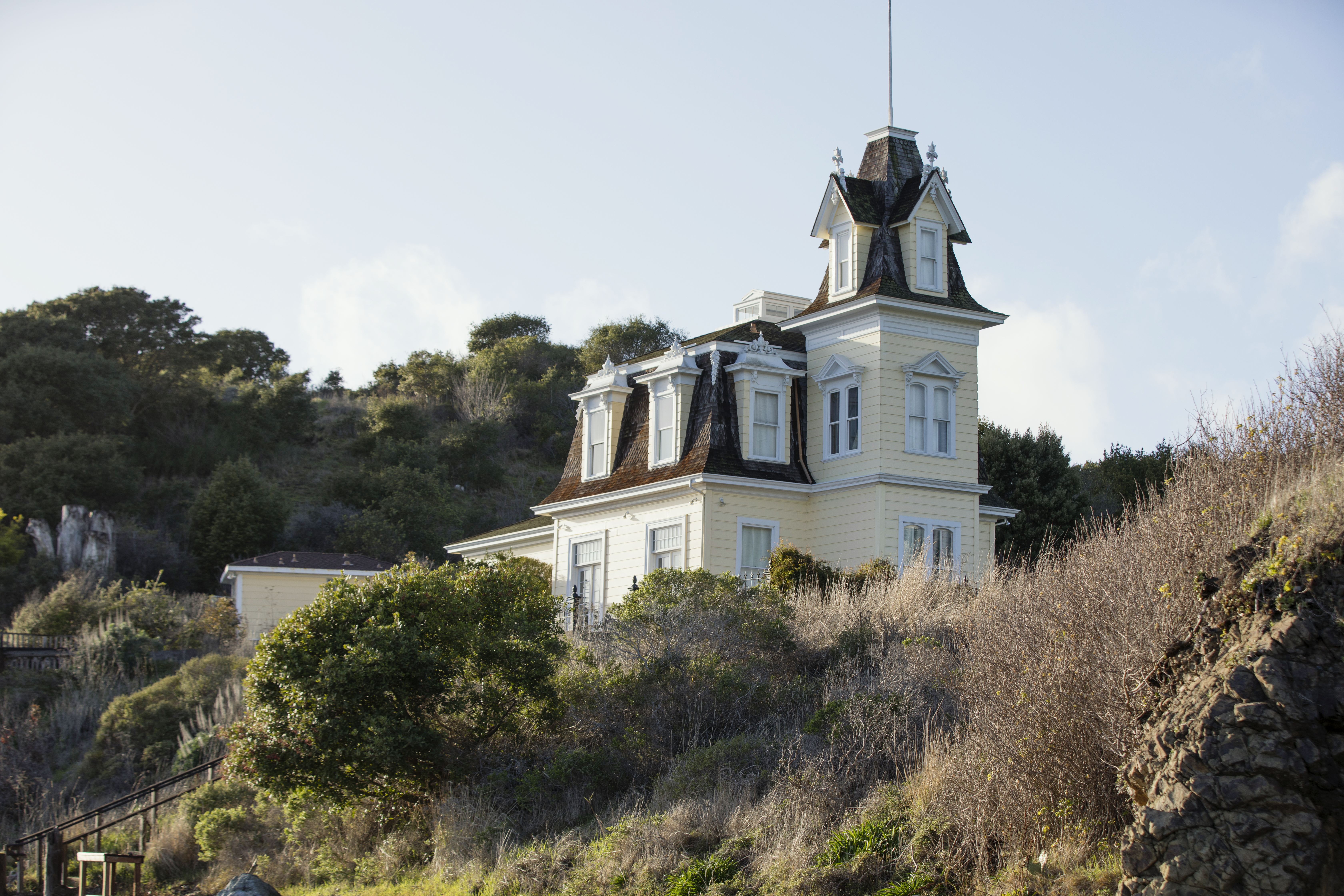 A Victorian house on a coastal bluff.