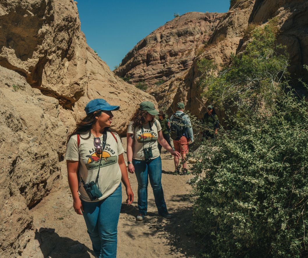 Audubon California staff Camila Bautista and Rhian Reyes hiking Painted Canyon, part of the 26,242 acres Mecca Hills Wilderness area in the proposed Chuckwalla National Monument.