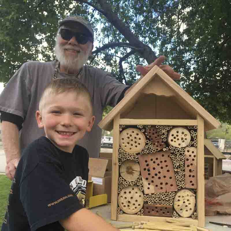 Jim Lutomski and a Pagosa Family School student with a pollinator structure. Photo: Jane Parker