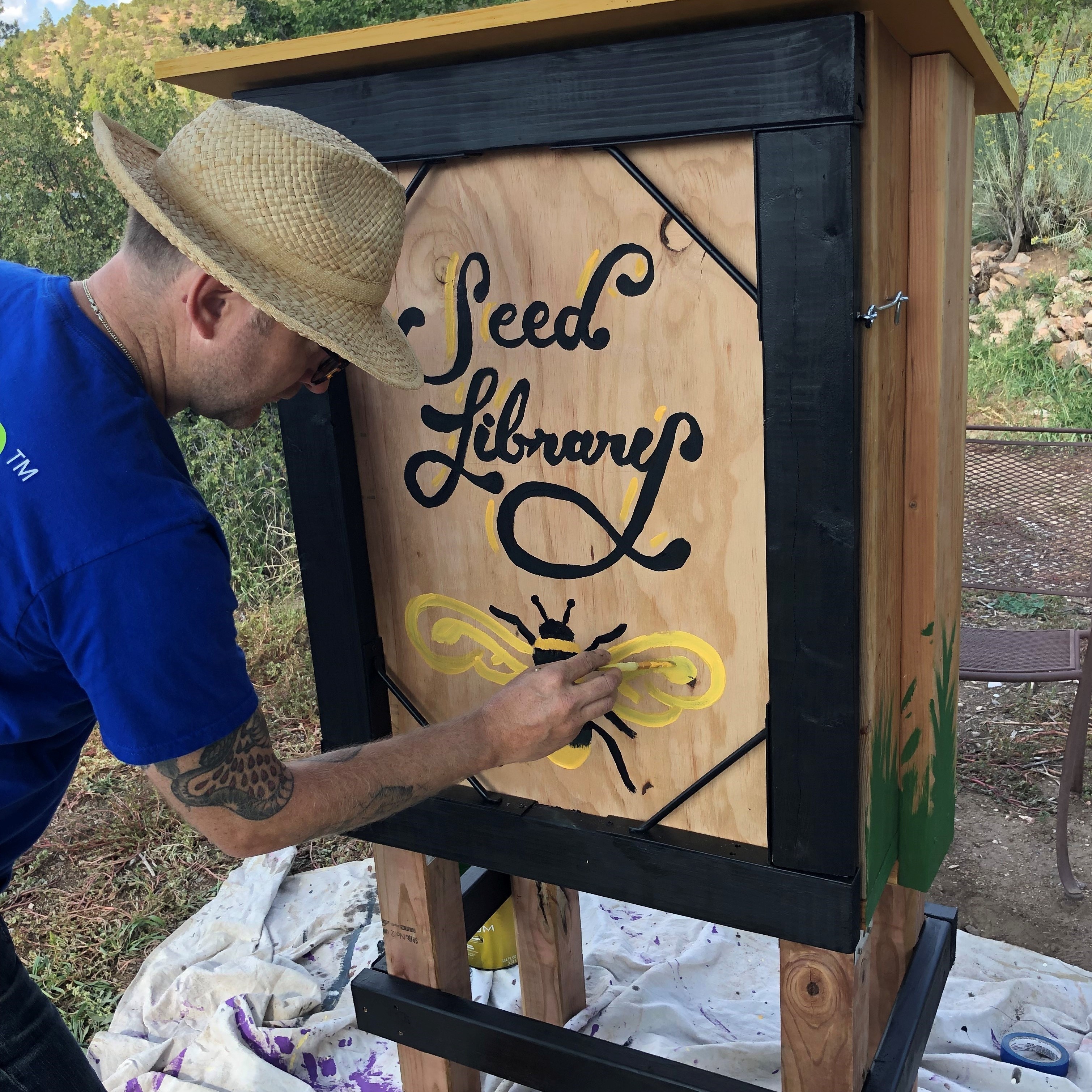 Patrick Iverson puts the finishing touches on the seed library
