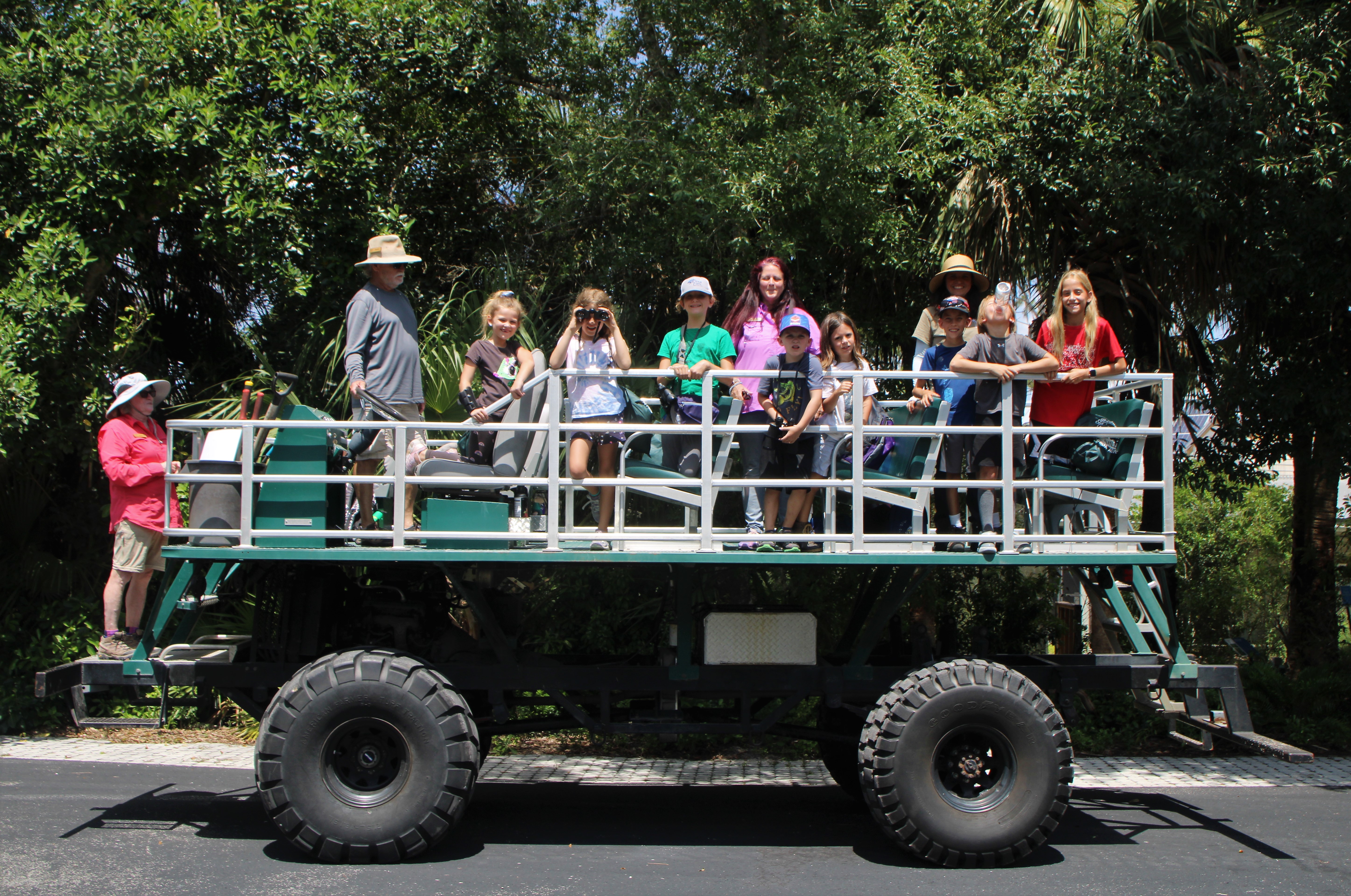 Kids onboard a large vehicle.