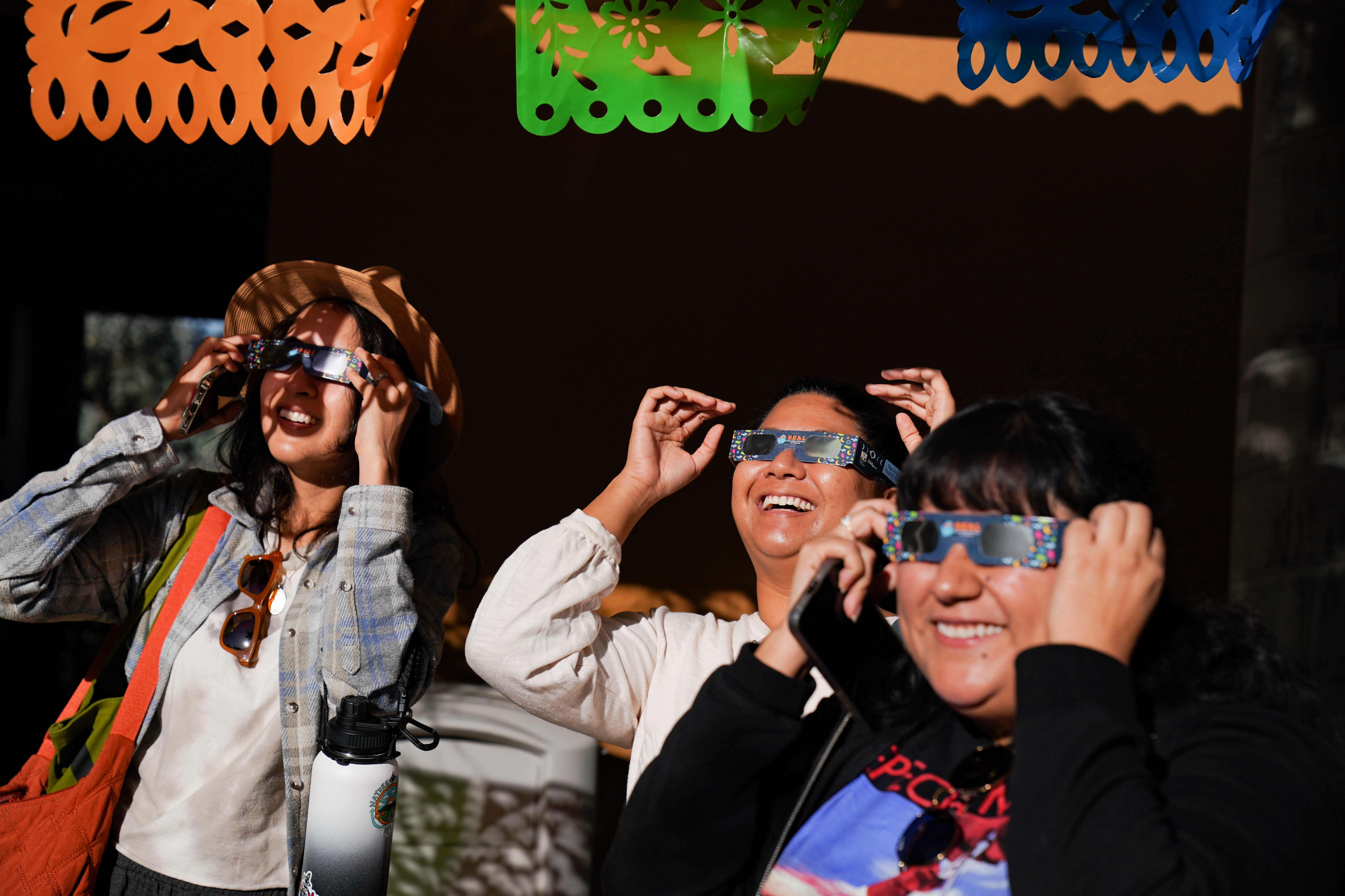 Attendees watching eclipse. 