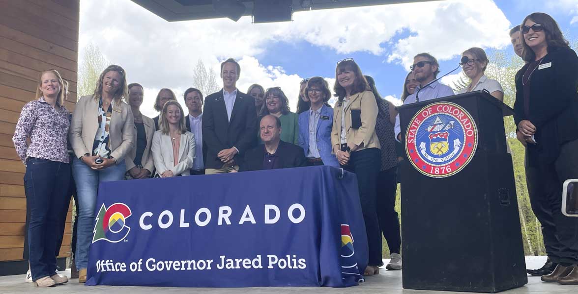 Colorado Governor Jared Polis at the signing of HB24-1379.