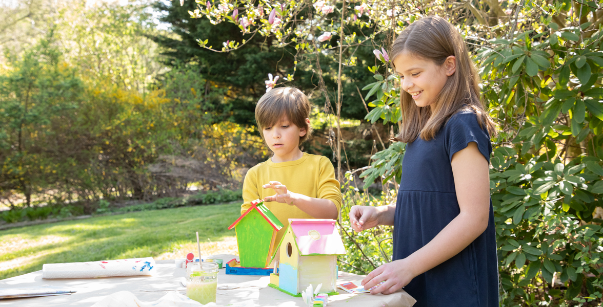 Kids assemble a MasterPieces DIY birdhouse kit.