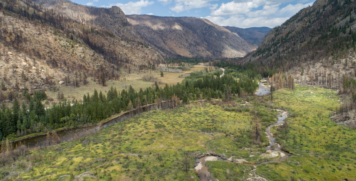A river runs through a mountain valley.