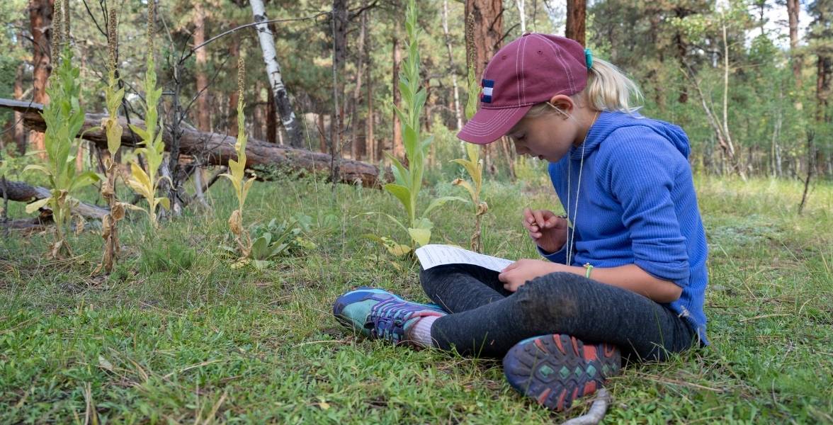 A fourth-grade student participates in an outdoor activity.