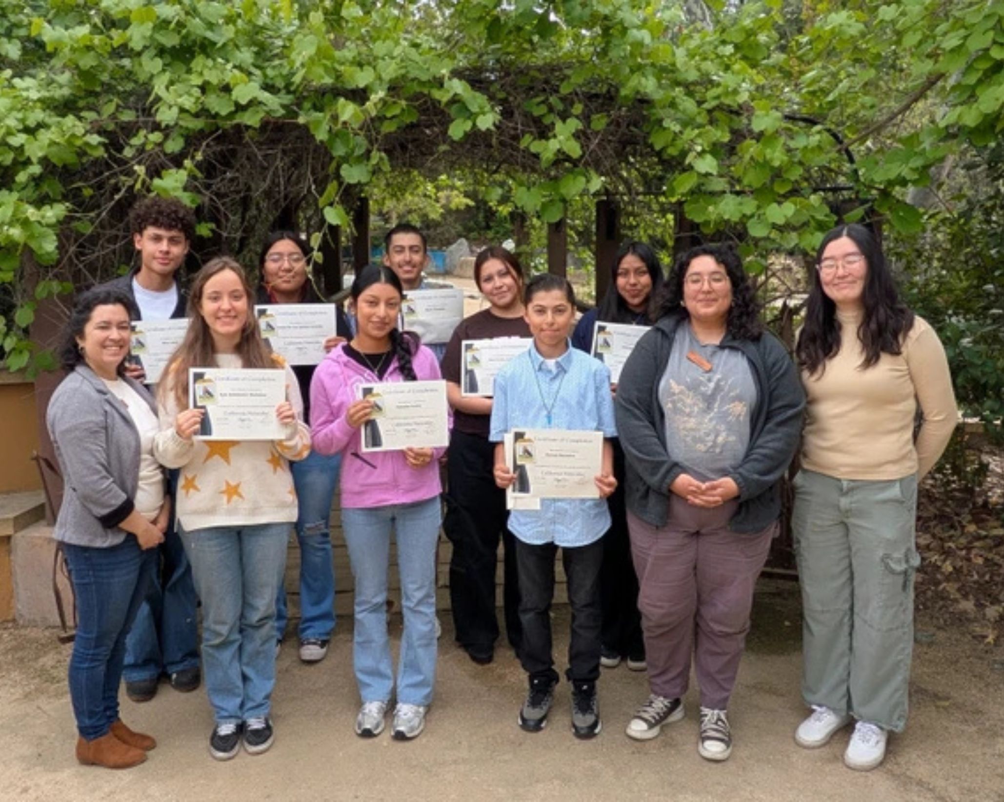 Audubon Center at Debs Park staff (left to right) Evelyn Serrano (Center Director), Amaris Corona Sandoval (Community Conservation Fellow), and He Sung Im (Public Programs Manager) with the Summer 2025 Audubon Youth Leaders graduating class. Photo: Evelyn Serrano.