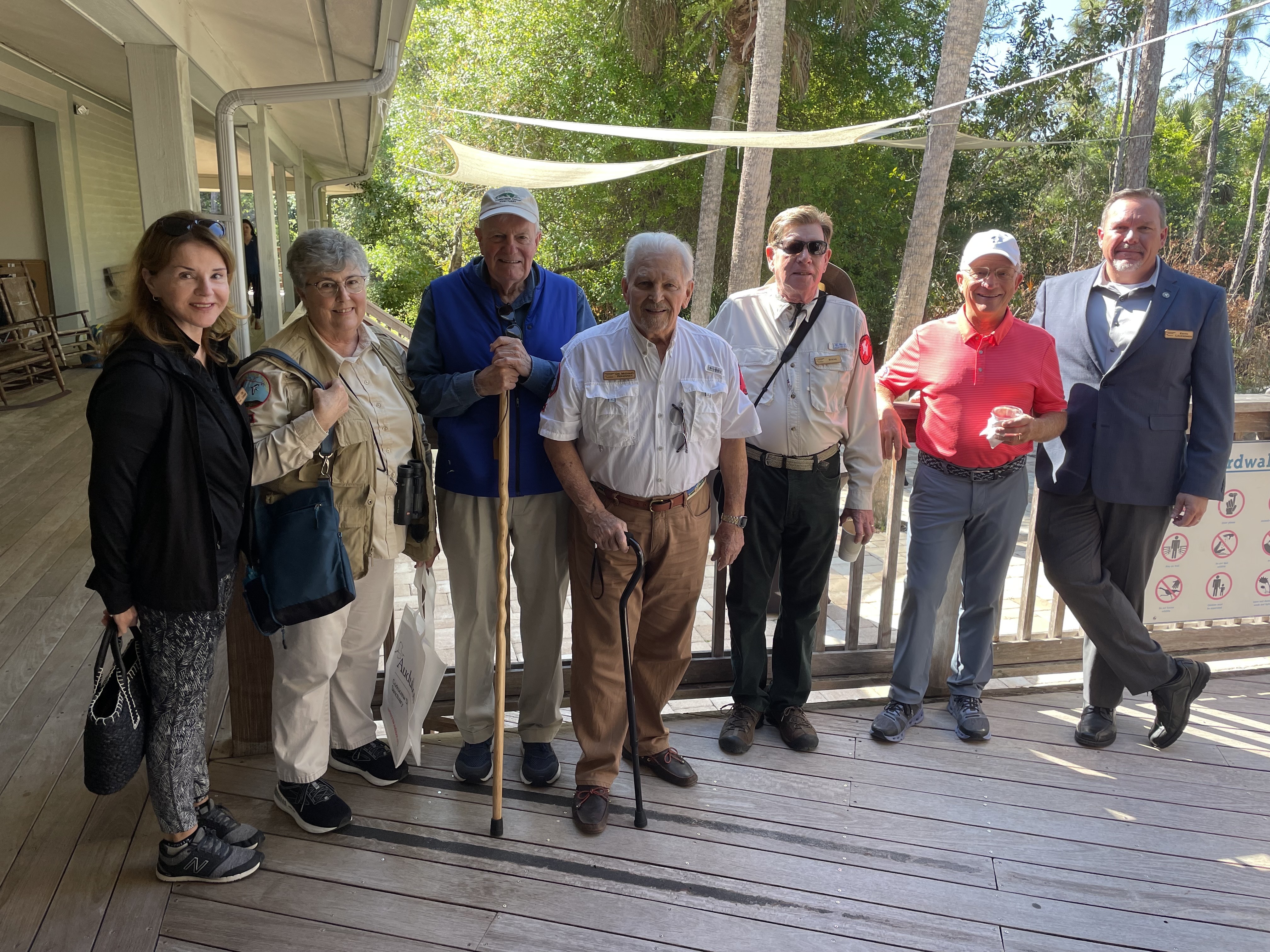 A group of people standing in a line outdoors 