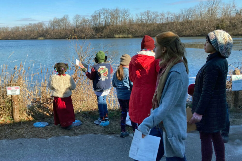 Julie leading an outdoor nature journaling event. 
