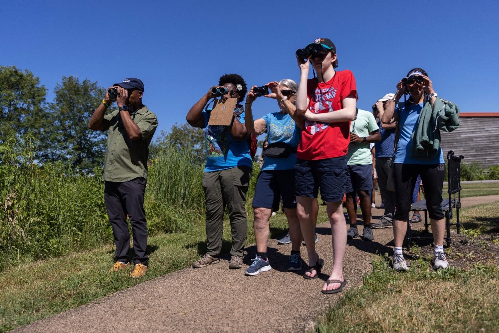 Dudley Edmondson and Nicole Jackson guiding community members on the bird walk.